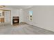 Bright living room featuring a fireplace, carpeted flooring, and neutral decor at 17034 E Tennessee Dr # 106, Aurora, CO 80017