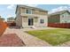 This home features a partially xeriscaped backyard with a sliding door entrance and new solar panels at 2682 E 161St Pl, Thornton, CO 80602