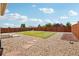 Backyard featuring green grass and rock at 2682 E 161St Pl, Thornton, CO 80602
