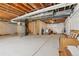 Unfinished basement featuring wood framing and utilities at 2682 E 161St Pl, Thornton, CO 80602