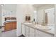 Bathroom boasts dual sinks, framed mirrors, and vanity with ample counter space at 2682 E 161St Pl, Thornton, CO 80602