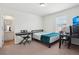 Bedroom features neutral carpet, desk and a bed at 2682 E 161St Pl, Thornton, CO 80602