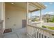 A welcoming front porch with classic railing details offers a view of the quiet, residential neighborhood at 2682 E 161St Pl, Thornton, CO 80602