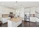 Modern kitchen with a large island, stainless steel appliances, and ample cabinet space at 2682 E 161St Pl, Thornton, CO 80602