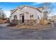 Two-story house with gray siding, stone accents, and a view of the front yard and driveway at 10147 Wyandott Cir, Denver, CO 80260