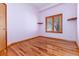 Charming bedroom with hardwood floors, ample natural light, and a neutral color palette at 15851 Deer Ridge Dr, Morrison, CO 80465