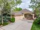 Charming single-story home with a well-manicured lawn, inviting curb appeal, and an attached two-car garage at 15851 Deer Ridge Dr, Morrison, CO 80465