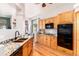 Bright kitchen featuring a breakfast nook, granite countertops and modern appliances at 15851 Deer Ridge Dr, Morrison, CO 80465