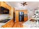 Well-lit kitchen with granite countertops, stainless steel appliances, and updated cabinetry at 15851 Deer Ridge Dr, Morrison, CO 80465