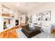 Comfortable living room featuring a fireplace, hardwood floors, and neutral decor at 15851 Deer Ridge Dr, Morrison, CO 80465