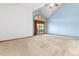 Airy main bedroom featuring vaulted ceilings and a sliding glass door to a deck at 15851 Deer Ridge Dr, Morrison, CO 80465