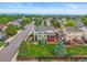 Aerial of home, fenced yard, lush trees in suburban neighborhood at 1120 N Calhan Ave, Castle Rock, CO 80104