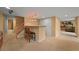 A basement bar area complete with barstools, storage cabinets, and pendant lighting at 1120 N Calhan Ave, Castle Rock, CO 80104