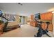 A basement gym and office area with walkout access to the backyard at 1120 N Calhan Ave, Castle Rock, CO 80104