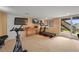 A basement gym area with gym equipment and walkout access to the backyard and patio area at 1120 N Calhan Ave, Castle Rock, CO 80104