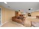 A basement living room with comfortable furniture and access to other areas in the home at 1120 N Calhan Ave, Castle Rock, CO 80104