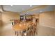 A basement rec room with a large table for games, dining and a comfortable sofa for entertaining at 1120 N Calhan Ave, Castle Rock, CO 80104