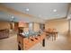 A spacious basement rec room with a foosball table and lots of space for games and activities at 1120 N Calhan Ave, Castle Rock, CO 80104