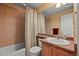 Bathroom featuring tile surround, vanity, and toilet at 1120 N Calhan Ave, Castle Rock, CO 80104