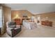 Spacious bedroom featuring plush carpet, natural light, and a sitting area at 1120 N Calhan Ave, Castle Rock, CO 80104