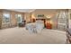 Spacious bedroom featuring plush carpet, natural light, and matching furniture at 1120 N Calhan Ave, Castle Rock, CO 80104