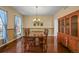Formal dining room featuring hardwood floors and a wooden table set and built in hutch at 1120 N Calhan Ave, Castle Rock, CO 80104
