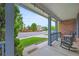 Inviting front porch with rocking chairs and string lights, perfect for relaxing outdoors at 1120 N Calhan Ave, Castle Rock, CO 80104