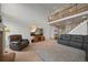 Spacious living room with a high ceiling, modern furniture, and a view of the upper level at 1120 N Calhan Ave, Castle Rock, CO 80104