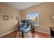Bright office space featuring hardwood floors, natural light, and a desk at 1120 N Calhan Ave, Castle Rock, CO 80104
