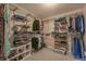 Spacious walk-in closet with custom shelving for optimal organization at 1120 N Calhan Ave, Castle Rock, CO 80104