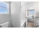 Bathroom with bathtub, toilet and bedroom view at 22022 E 38Th Pl, Aurora, CO 80019