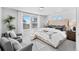 Main bedroom with a large bed and plenty of natural light at 22022 E 38Th Pl, Aurora, CO 80019