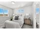 Cozy bedroom with a wooden nightstand and ensuite bathroom at 22022 E 38Th Pl, Aurora, CO 80019
