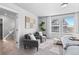 Bright bedroom with two armchairs and a view at 22022 E 38Th Pl, Aurora, CO 80019