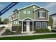 Two-story green and brown house with a two-car garage at 22022 E 38Th Pl, Aurora, CO 80019