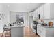 Open concept kitchen with stainless steel appliances and island at 22022 E 38Th Pl, Aurora, CO 80019