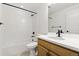 Modern bathroom features a white tiled shower, a coordinating vanity and sleek black fixtures at 39730 Congress Ln, Elizabeth, CO 80107