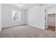 Bright bedroom featuring new carpet, closet door, and window for natural light at 39730 Congress Ln, Elizabeth, CO 80107