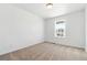 Bedroom with a large window for natural light and neutral carpet flooring at 39730 Congress Ln, Elizabeth, CO 80107