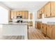 Bright kitchen features wood cabinets, stainless steel appliances, and granite countertops at 39730 Congress Ln, Elizabeth, CO 80107
