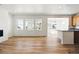 Open concept living room with lots of natural light and wood flooring at 39730 Congress Ln, Elizabeth, CO 80107