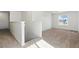 Bright loft area with neutral carpet, one large window, and white walls at 39730 Congress Ln, Elizabeth, CO 80107