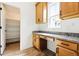 Office features a built-in desk with granite countertops and wood cabinets at 39730 Congress Ln, Elizabeth, CO 80107