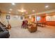 Basement featuring carpeting, neutral paint, and comfortable seating, an inviting space for relaxation and recreation at 7169 S Grape Ln, Centennial, CO 80122