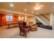 Finished basement featuring carpeting, neutral paint, and comfortable seating, offering a cozy retreat at 7169 S Grape Ln, Centennial, CO 80122