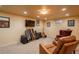 Basement with carpet and neutral paint, offering a welcoming space for hobbies and entertainment at 7169 S Grape Ln, Centennial, CO 80122