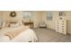 Bedroom featuring carpeting, neutral paint, and two windows, creating a peaceful and bright atmosphere at 7169 S Grape Ln, Centennial, CO 80122