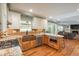 Modern kitchen featuring granite countertops, stainless steel appliances, custom cabinets, and hardwood floors at 7169 S Grape Ln, Centennial, CO 80122