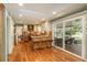 Bright eat-in kitchen featuring stainless steel appliances, wooden cabinets and island with stool seating and sliding glass doors at 7169 S Grape Ln, Centennial, CO 80122
