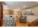Cozy living room features hardwood floors, neutral paint, wainscoting, recessed lighting, and comfortable seating at 7169 S Grape Ln, Centennial, CO 80122